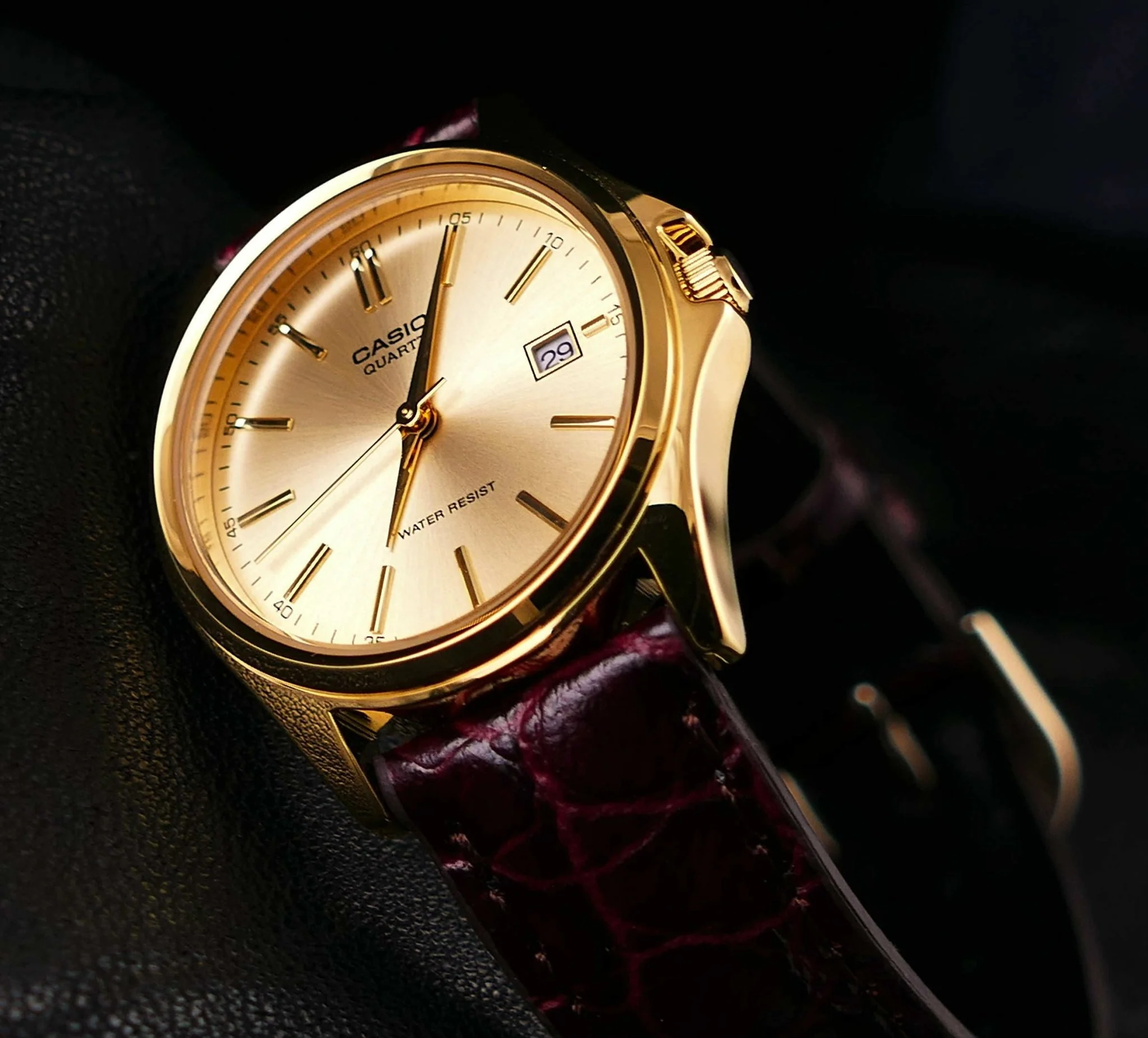 Close-up of champagne dial and date display on Casio LTP-1183Q-9ADF