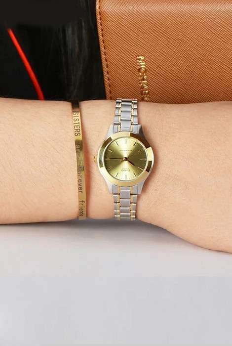 Side view of Casio LTP-1128G-9ARDF showing slim profile and metal strap