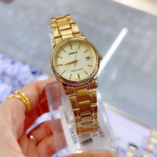 Champagne dial with date display close-up