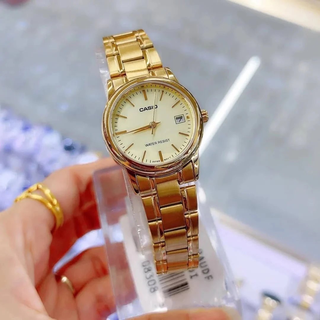 Champagne dial with date display close-up