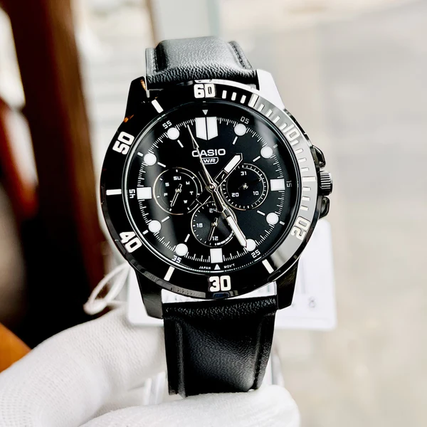 Side view of Casio leather strap watch with day-date sub-dials