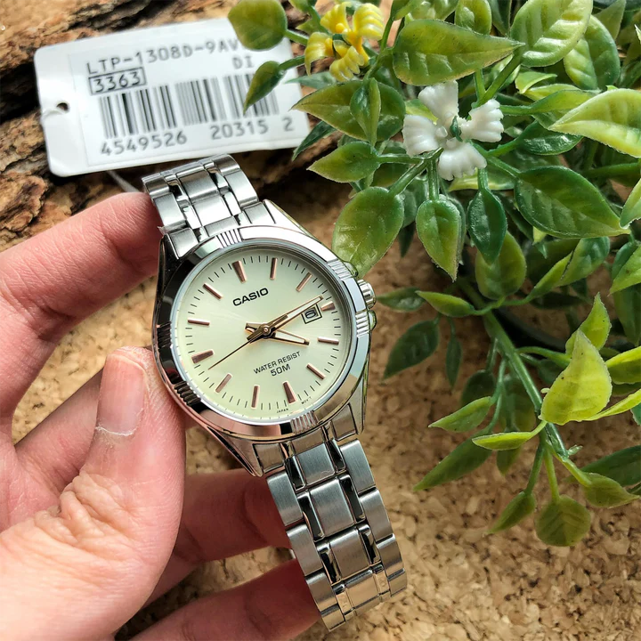 Close-up of gold dial and date display on Casio watch

