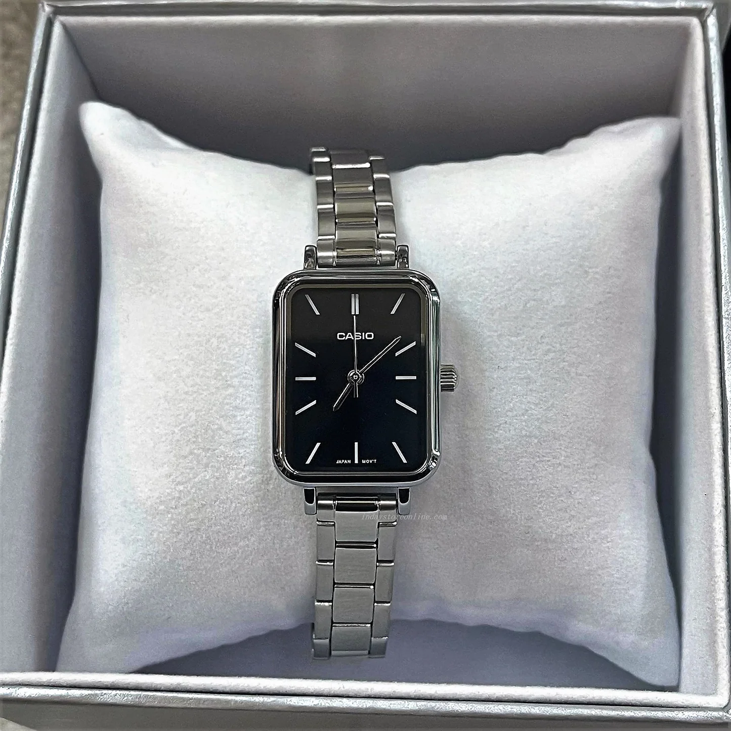 Side profile showing sleek case and clasp