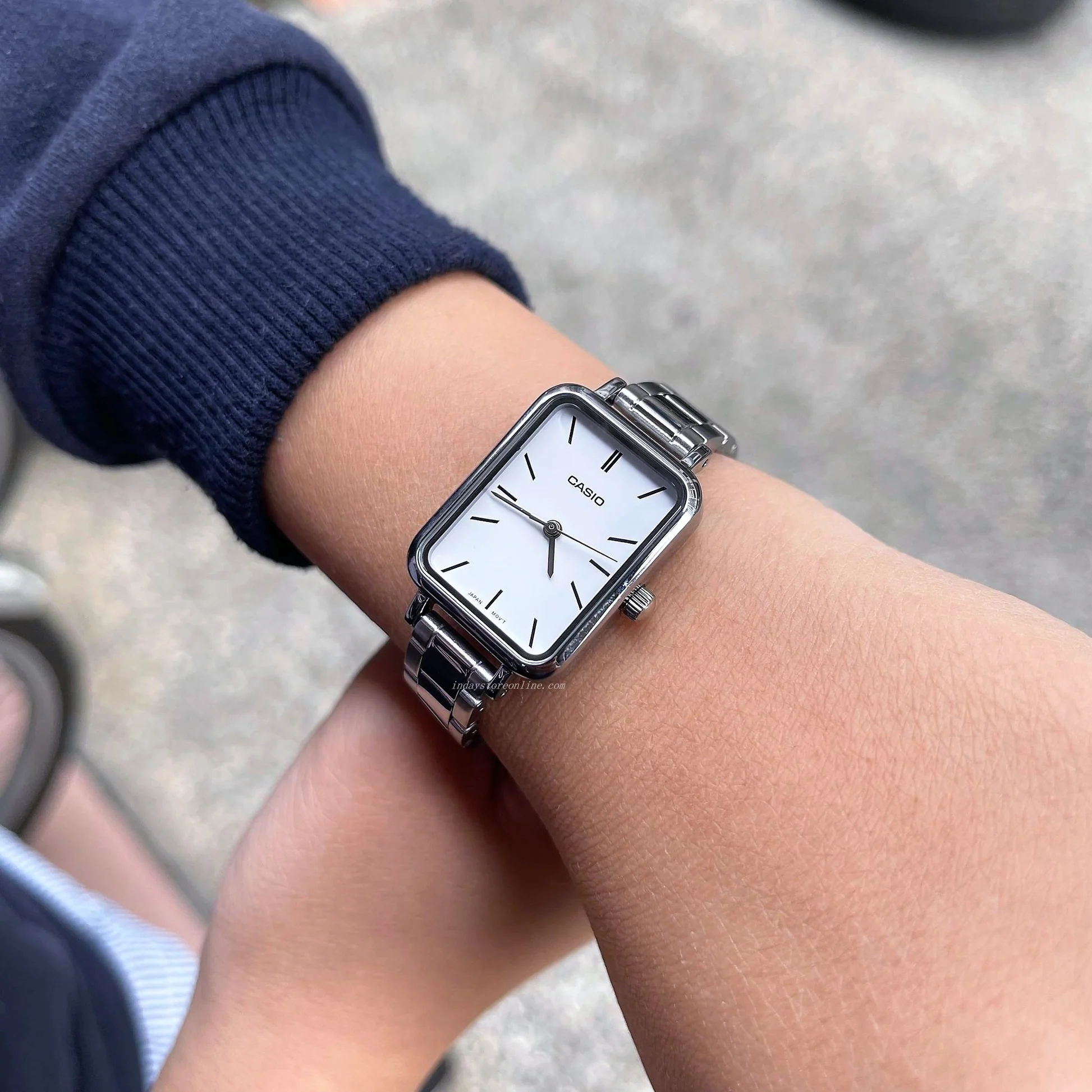 Side profile showing sleek case and clasp