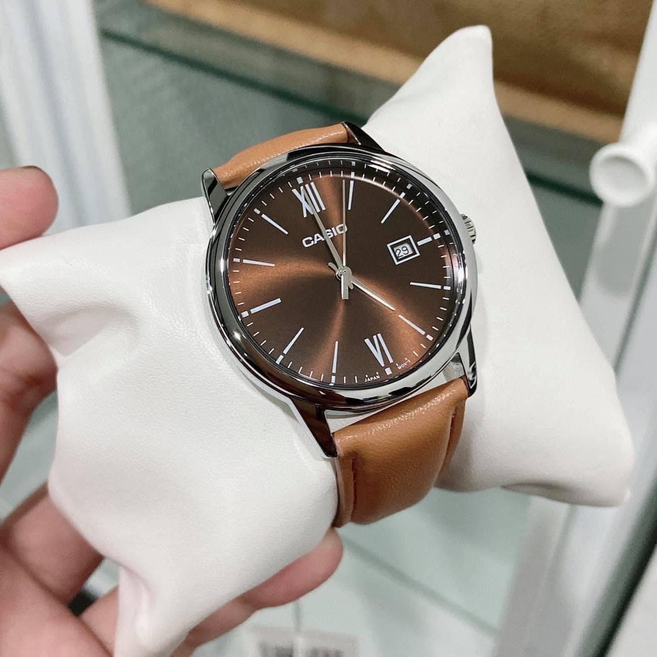 Side angle of Casio watch showing case and brown strap