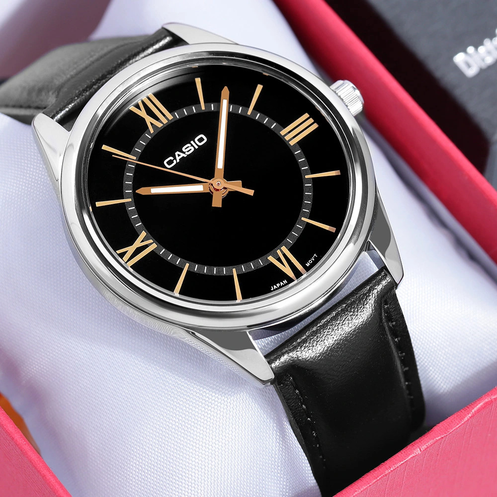 Close-up of gold-tone markers on black Casio dial