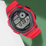 Side angle of sporty Casio watch with rugged orange build