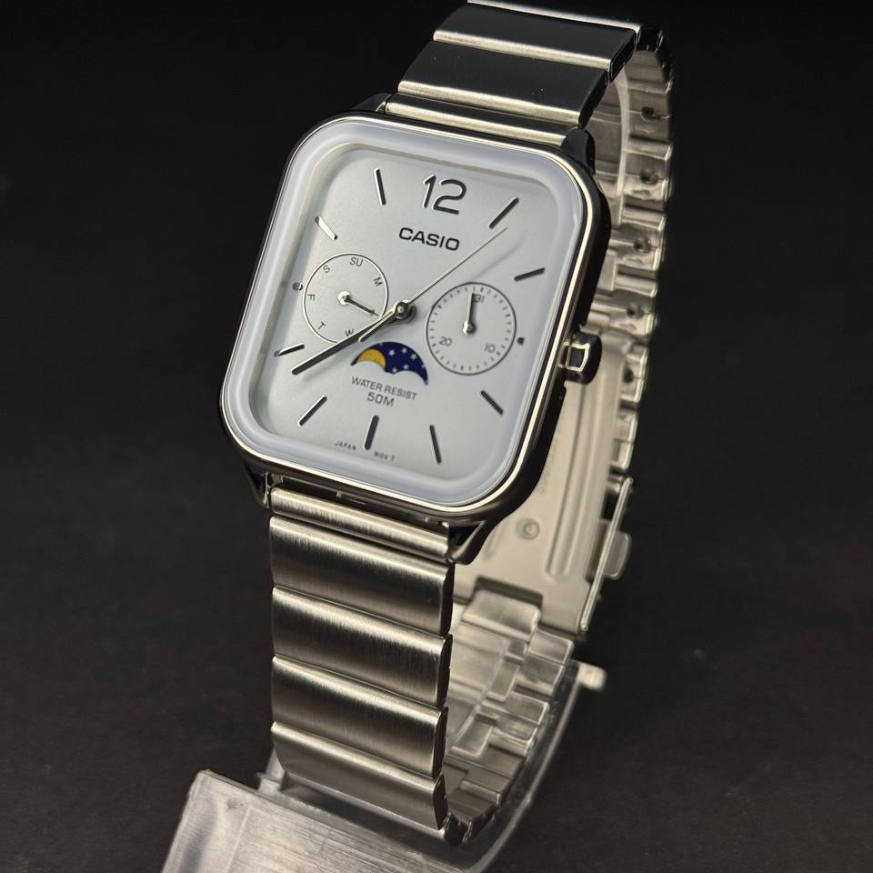 Close-up of deep blue dial with day/date indicators

