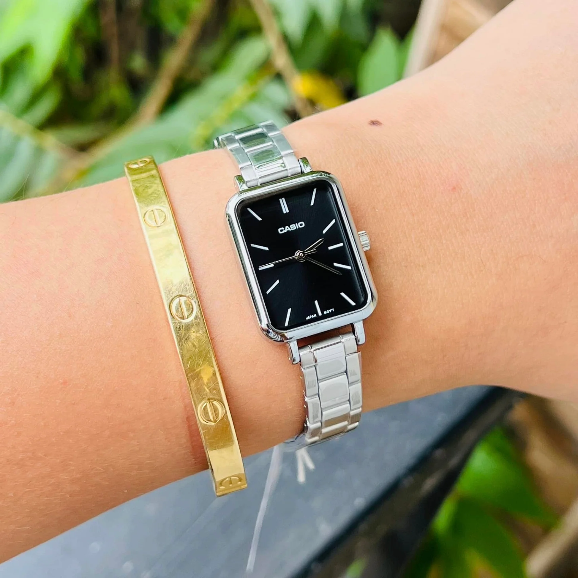 Close-up of dial and stainless steel band